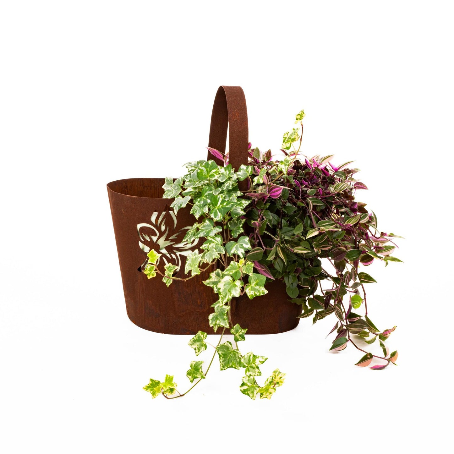 Rustic metal planter with handle, cut-out floral pattern, natural rusty finish