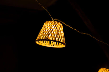 Outdoor LED string lights with 16 bamboo shades, 4.5m long. Plug and transformer are included.